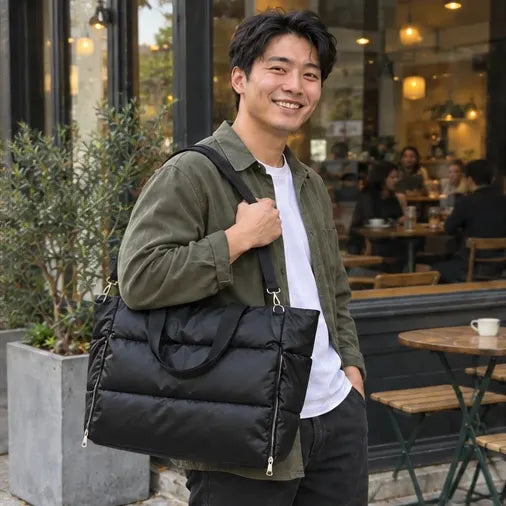 Illustrative AI-generated photo of a man carrying the black The Everyday Puffer