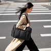 Black All-Day Tote - carried at a city crosswalk