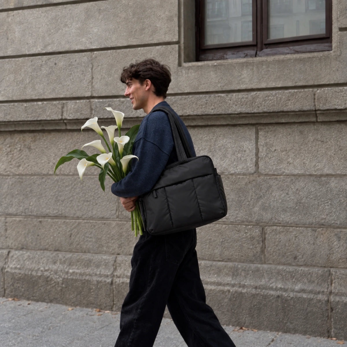Black All-Day Tote - carried by a man holding flowers