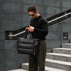 Black Everyday Puffer — lifestyle photograph on steps