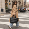 Black Everyday Puffer carried on a city street