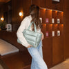Sage Everyday Puffer — lounge lifestyle photograph