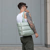Sage Everyday Puffer — carried over the shoulder