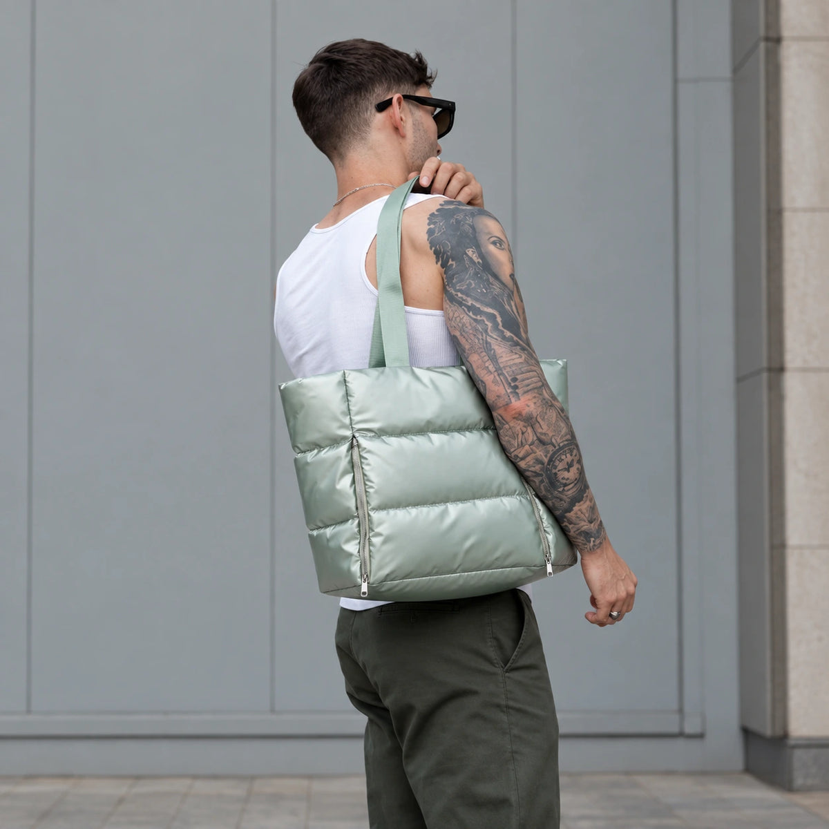 Sage Everyday Puffer — carried over the shoulder