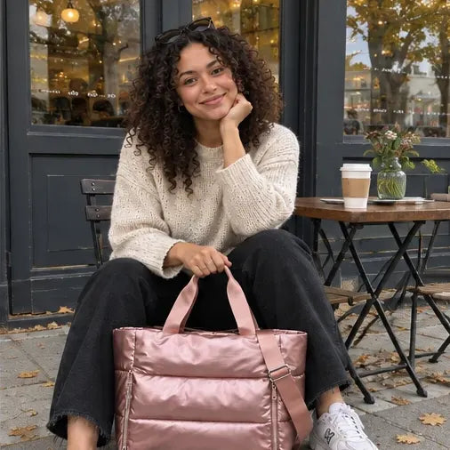 Illustrative AI-generated café photo of a woman with a rose puffer tote